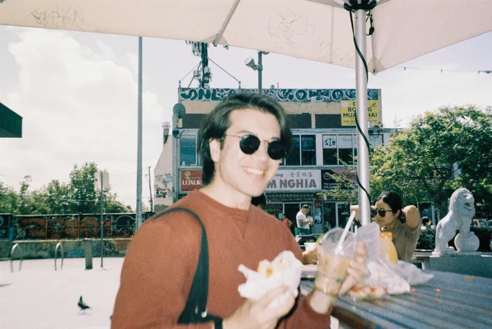 Francis, eating a banh mi